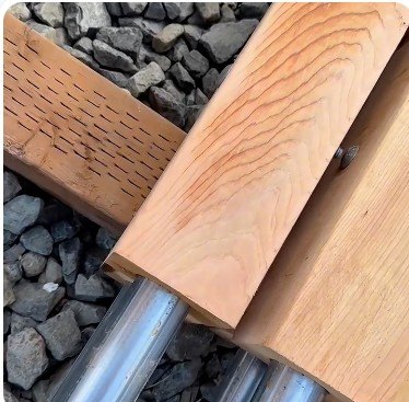 Cedar posts drilled for the steel pipe