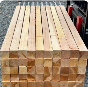 A bundle of cedar posts loaded for delivery
