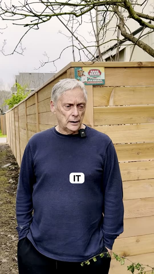 Monroe homeowner in front of his new fence